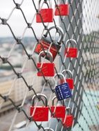 metal locks on the lattice of the bridge