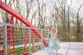 happy girl in blue dress running