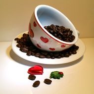 cup with coffee beans for Valentine's day
