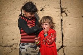 laughing girls in a village