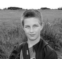 Black and white photo of the young boy