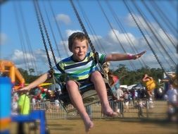 the child flies on a swing