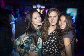 three friends relax in the bar