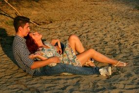 happy couple on the beach sand