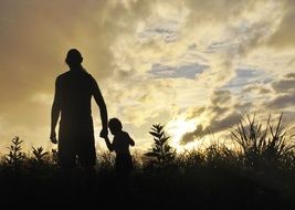Father and son in a field