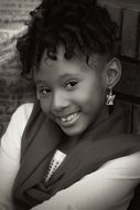 black and white photo of a smiling black girl