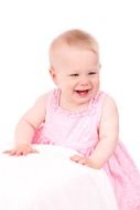 smiling little girl in pink dress