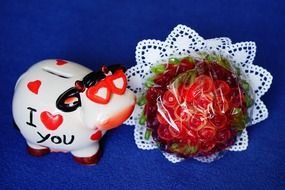 pig money box with bouquet roses presents