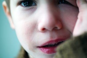 photo of sad boy close up