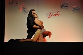 man and woman kneeling on scene, passion dance