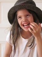 girl in hat laugh