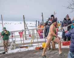 naked man in the snow