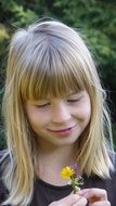 photo of girl with dandelion