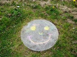 smiley face drawn in chalk