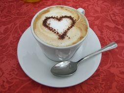 Drawed heart on the cappuccino