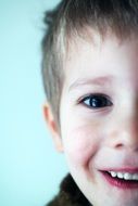 photo of a smiling boy closeup