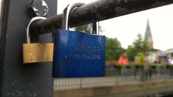 love locks on a metal pipe