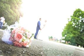 wedding photo of a couple on the background of a bouquet of flowers