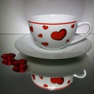 cup with heart with mirror reflection