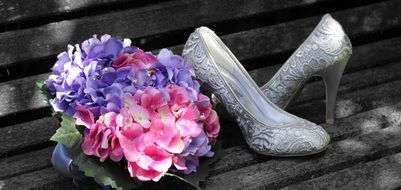 pink-purple bouquet and wedding shoes