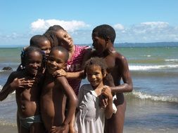 african children laughing on beach