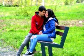 couple of lovers on a bench in the park