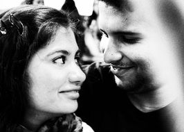 black and white photo of a couple in love looking at each other