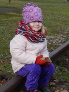 Photo of the smiling girl sitting