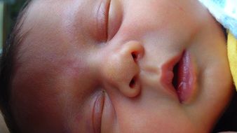 sweet sleeping baby in the crib