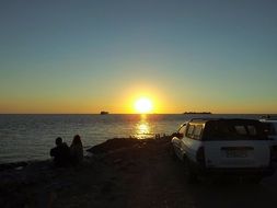 couple on the beach at sunset