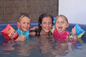 smiling children in the pool