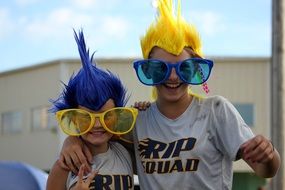 young people in carnival glasses