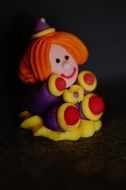 A figurine of a colorful clown