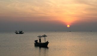 fishing boats on the background of sunrise in Thailand