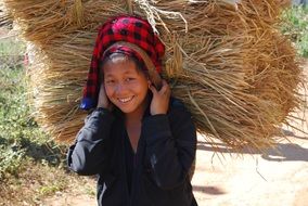 girl with a straw on her shoulders