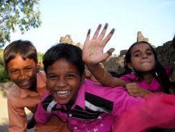 indian children waving and laughing