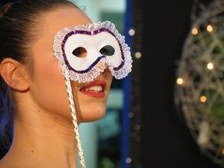 girl with a white carnival mask