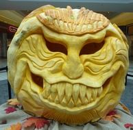 Evil sculpture on a pumpkin