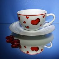 coffee cup with red hearts