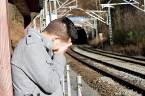 boy crying at the railway