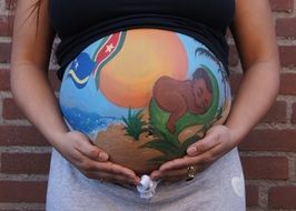 drawing on the belly of a pregnant woman