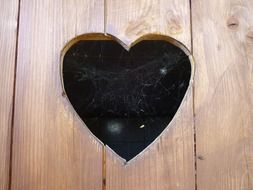 window in the form of hearts on a wooden doors