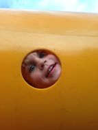 Child is playing on the playground