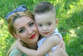 little boy hugging mother