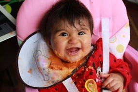 baby Laura Isabel in mashed carrots