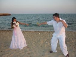 wedding couple on beach at sea