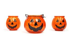 Decorative candles in the shape of pumpkins for Halloween celebrations