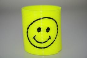 painted smiley on a yellow spring