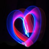 neon heart on black background
