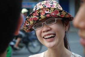 smiling vietnamese child girl in colorful hat